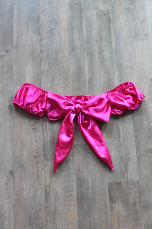 Pink silky satin crop top with adjustable tie detail.
